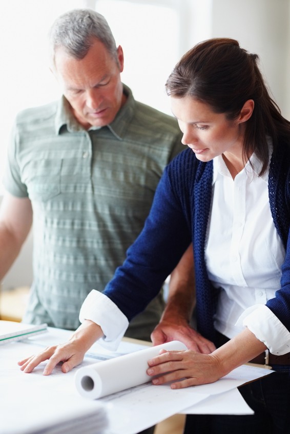 two people looking at plans
