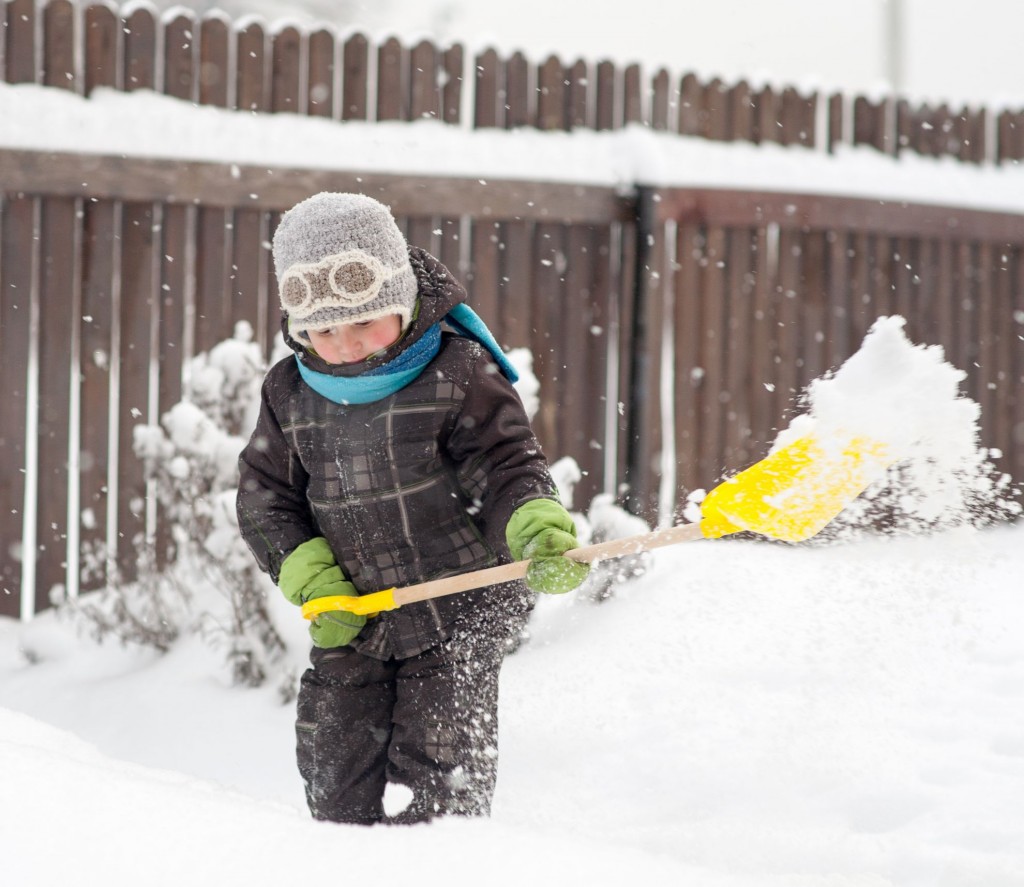 kid shoveling snow in Cleveland Ohio