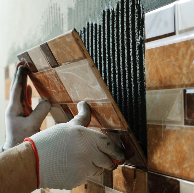 remodeler laying tile
