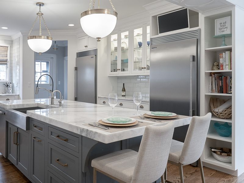 white kitchen cabinets and gray island